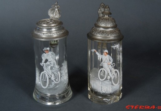2 decorative glass tankards with bicycle motif  