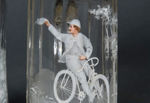 2 decorative glass tankards with bicycle motif  