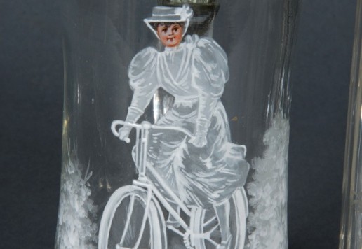 2 decorative glass tankards with bicycle motif  