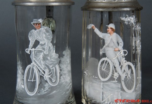 2 decorative glass tankards with bicycle motif  