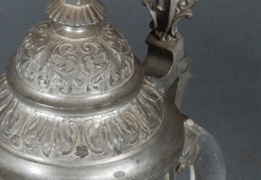 2 decorative glass tankards with bicycle motif  